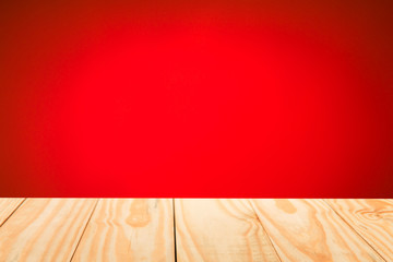 Wood table top on abstract gradient red background