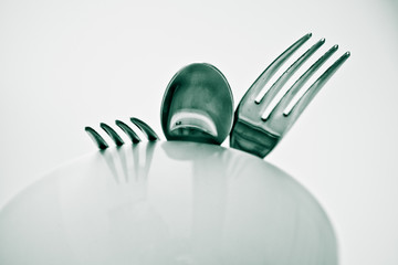 two forks , one spoon. Silver fork and spoon on the table. Basic cutlery