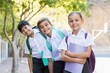 © WavebreakMediaMicro - Portrait of smiling school kids standing in campus