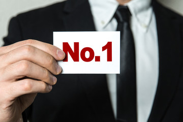 Wall Mural - business man holding a card with the text: no.1