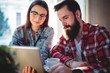© Wavebreak Media - Couple using digital tablet while sitting in cafe