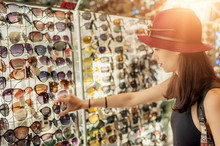 Woman Buying Sunglasses