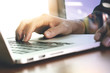© everythingpossible - close up of business man hand working on laptop computer with di