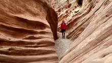 Young Woman Backpacker Exploring Little Wild Horse Canyon
