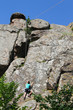 © olyasolodenko - Boy climbing on the rock