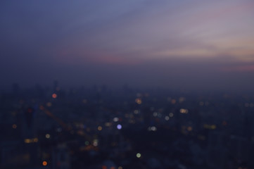 Wall Mural - Blurred aerial view of cityscape on warm light sundown