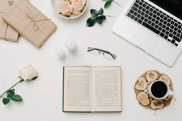 Opened book with glasses and coffee. White background. Education concept