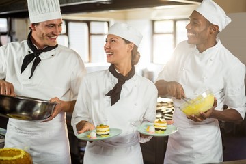 Wall Mural - Chefs preparing a dessert