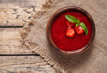 Strawberry soup healthy vegetarian summer berry fruit smoothie dessert food, vitamin rich nutrition meal on vintage wooden background