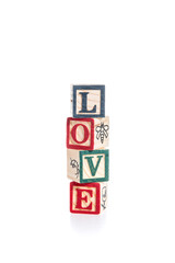 photo of a alphabet blocks spelling LOVE isolate on white backgr