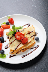 Wall Mural - crepes with strawberry on white plate