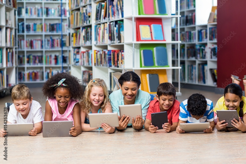 Teacher with students using digital tablet Stock Photo | Adobe Stock
