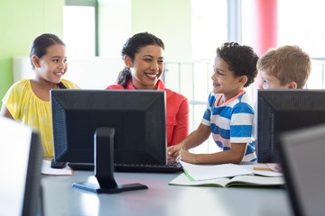 Wall Mural - Happy female teacher with children 