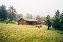 Log Cabin With Porch By Forest