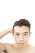 © oka - メンズビューティ　鏡を見るイメージ　汎用　白バック　カメラ目線