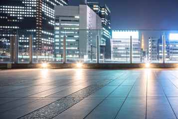 empty floor with modern office buildings in downtown of tokyo at