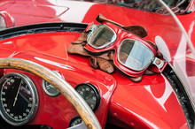 Glasses And Gloves Inside A Vintage Red Car