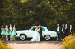 bride and groom with happy groomsmen and bridesmaids stay near old white retro car.
