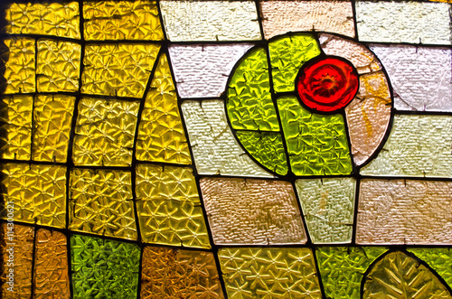 Fototapeta na wymiar Rectangular and round stained glass window with red rose. Abstract geometric colorful background.