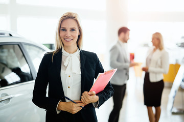 Wall Mural - Professional salesperson in car dealership