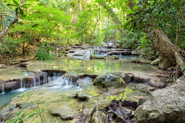 Beautiful waterfall and tropical forests at Erawan National Park is a famous tourist attraction in Kanchanaburi Province, Thailand