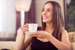 © zinkevych - Beautiful woman holding cup of coffee