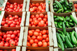 © vladdeep - boxes with cucumbers and tomatoes in supermarket. Healthy Eating