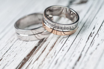 Wedding rings on rustic wood