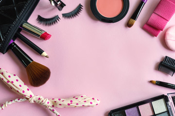 Wall Mural - various makeup products and cosmetics isolated on pink