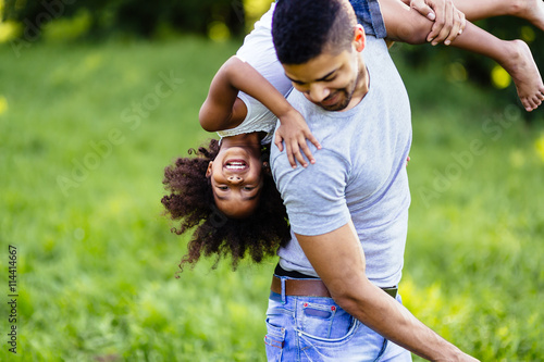 Fotografija  Happy daughter playing with dad