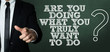 © gustavofrazao - Business man pointing with the text: Are You Doing What You Truly Want To Do?