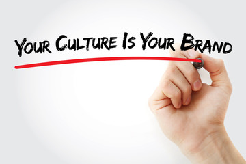 Hand writing Your Culture Is Your Brand with marker, concept background