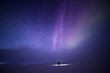 © Tiina Törmänen - Person bathed in light from Aurora borealis, Finland