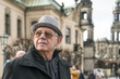 Germany, Dresden, happy senior man standing on Bruehl's Terrace
