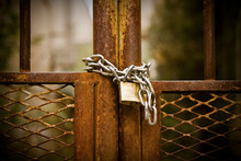 Rusty Metal Gate Closed With Padlock - Concept Image