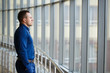 © davit85 - Businessman standing near the window and looking into it