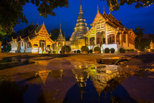 Wat Phra Sing With The Water Reflection After Rainning, Chiang Mai, Thailand At Night Time