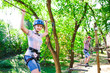© davit85 - adventure climbing high wire park - people on course in mountain