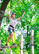 © davit85 - adventure climbing high wire park - people on course in mountain