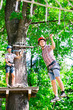 © davit85 - adventure climbing high wire park - people on course in mountain
