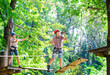 © davit85 - adventure climbing high wire park - people on course in mountain