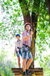 © davit85 - adventure climbing high wire park - people on course in mountain