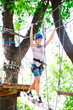 © davit85 - adventure climbing high wire park - people on course in mountain