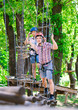 © davit85 - adventure climbing high wire park - people on course in mountain