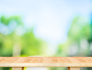 Aufkleber - Empty modern brown wood table top with sun and blur green tree b