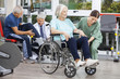 © Tyler Olson - Senior People Being Assisted By Physiotherapists In Rehab Center