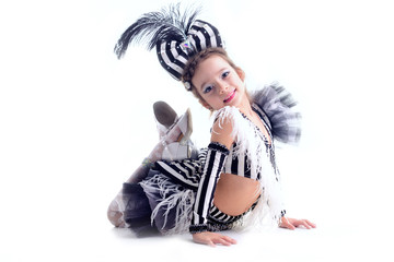 little girl dancing in the dress in the studio