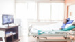 © naiyanab - abstract blurred photo of patient alone on hospital bed