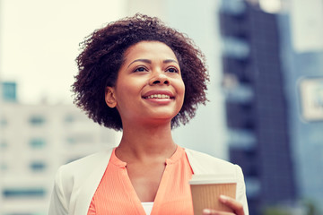 Sticker - happy african businesswoman with coffee in city