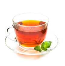 Transparent Cup Of Tea And Mint Leaves On White
